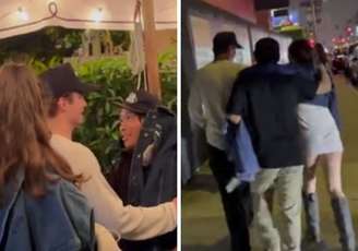 Pax, de blusa escura, sendo apoiado por amigo | Pax segurando em amigos para ficar de pé