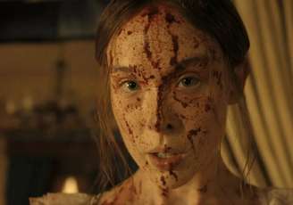 A atriz Lizzie Borden como Lizzie Borden, mulher acusada de assassinar o pai e a madrasta, em 1892