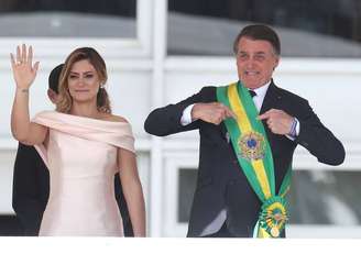 A primeira-dama Michelle Bolsonaro e o presidente Jair Bolsonaro no parlatório do Palacio do Planalto, em 2019