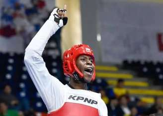 Henrique Marques garantir a inédita medalha de ouro. O brasileiro superou o representante local Qizhang Xiang na decisão da categoria até 80kg, por dois rounds a zero.