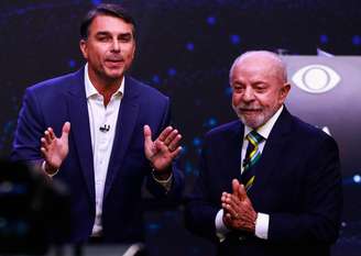 Flávio Bolsonaro e Lula durante debate da Band