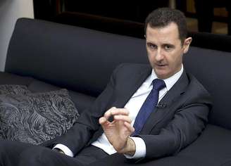 <p>Presidente sírio, Bashar al-Assad, fala durante entrevista a um jornal alemão, em Damasco</p>