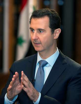 Assad em entrevista no palácio de governo, em Damasco